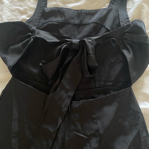 Black romper. Ties in  back. Size small. - Picture 1 of 4
